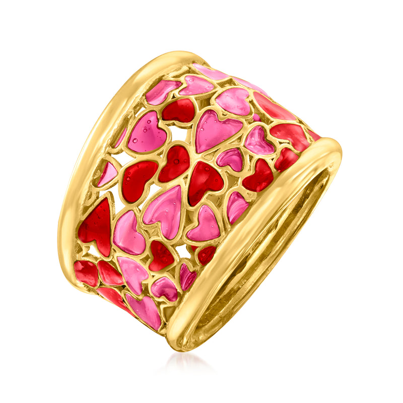 Gold enamel heart ring with pink and red heart cutout pattern, angled view