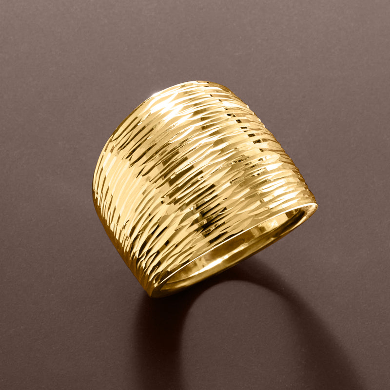 Yellow gold dome ring with textured diamond-cut surface