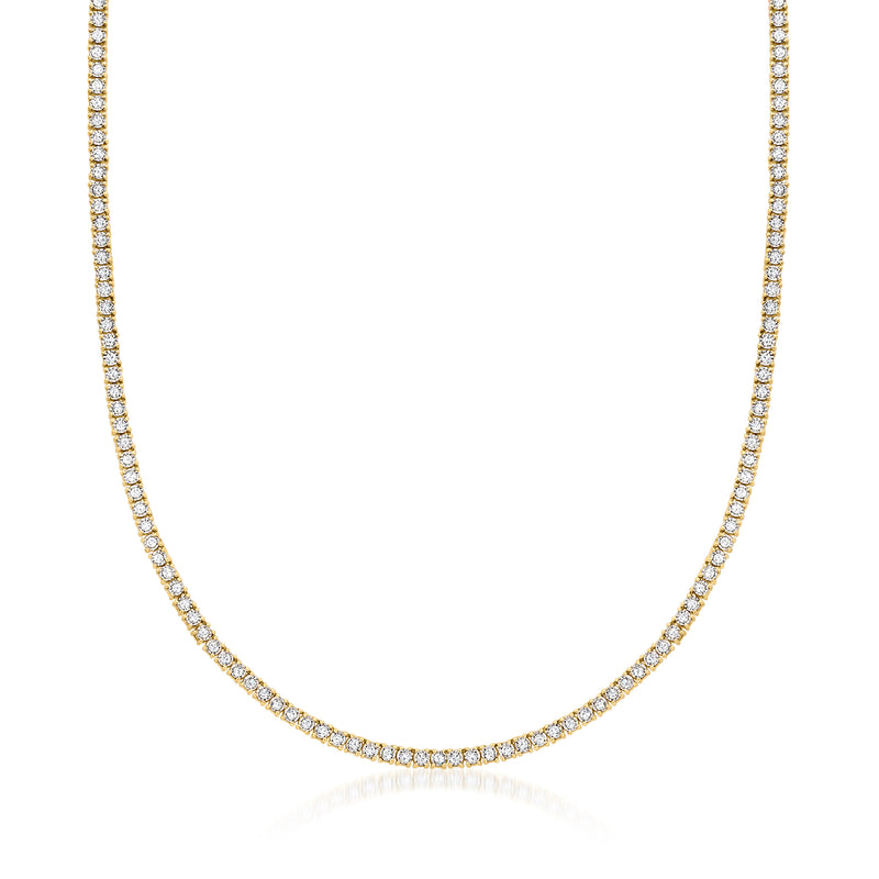 Gold tennis necklace with continuous round diamond-like stones in a curved line
