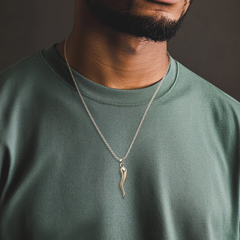 Horn pendant necklace worn; sterling silver pendant on chain