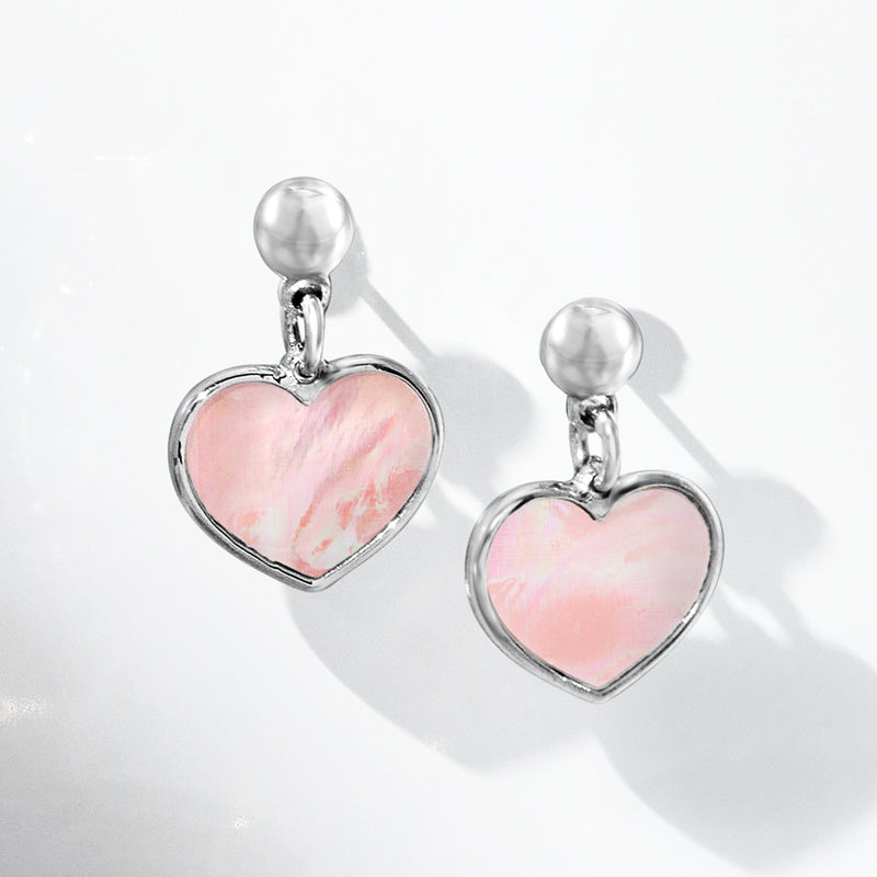 Sterling silver heart drop earrings featuring pink mother-of-pearl heart pendants