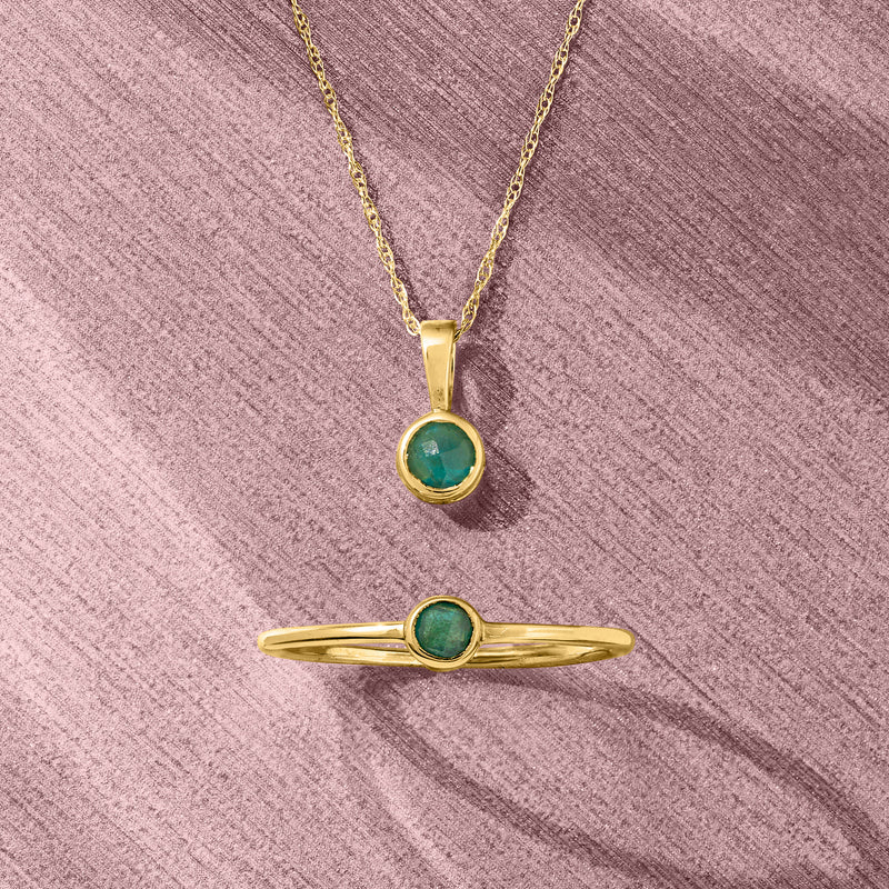 14kt yellow gold pendant and ring set with round green gemstones