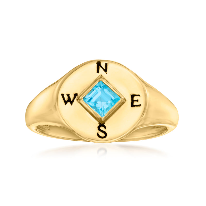 18kt gold compass signet ring with blue topaz center and black enamel N, E, S, W letters
