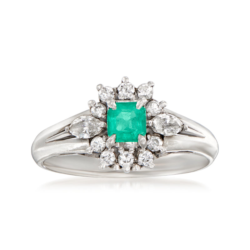 Vintage platinum ring with square emerald center and surrounding round diamonds