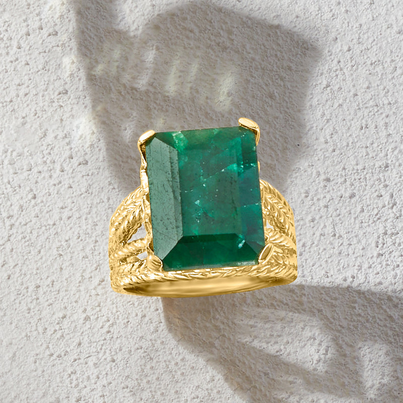 Emerald green square-cut gemstone ring with gold-tone setting and textured rope band