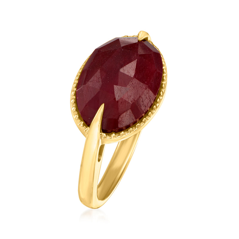 Oval ruby gemstone ring in gold, side view showing curved band and prongs