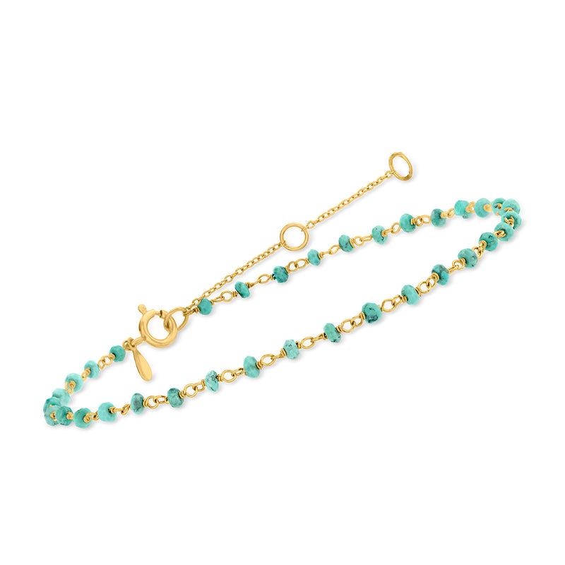 Turquoise bead anklet with gold clasp, chain, and round bead charms