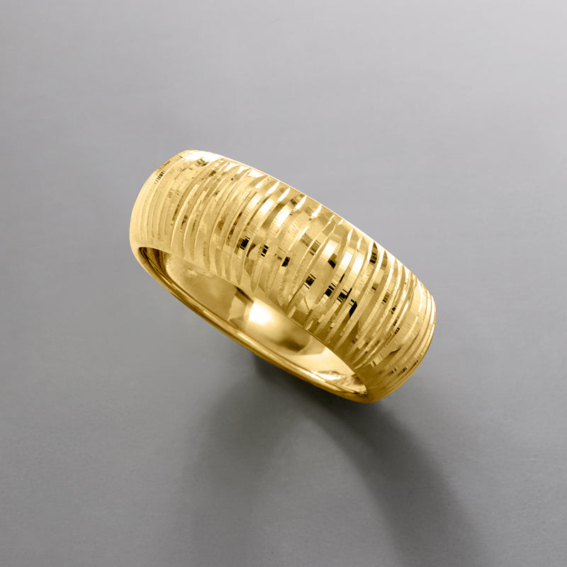 Yellow gold diamond-cut ring band with vertical grooves, side profile view