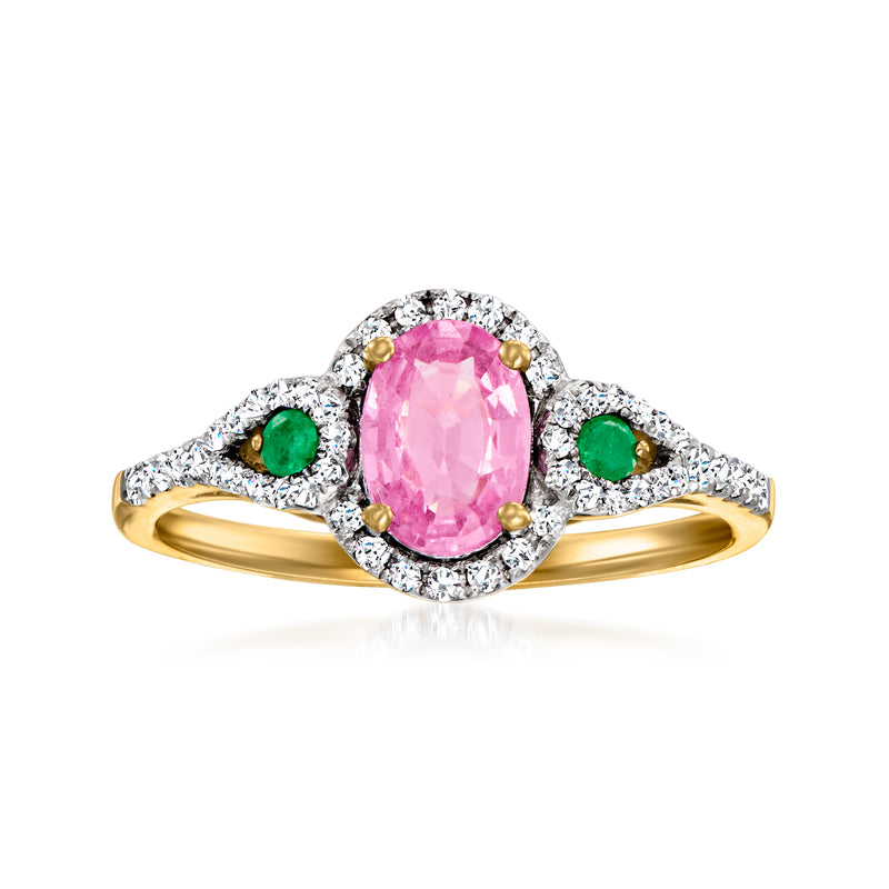 14kt yellow gold ring with oval pink sapphire, diamond halo, and two emerald accents