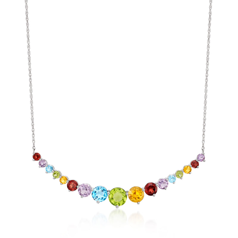 Curved sterling silver necklace with multicolor gemstone stations along a fine chain