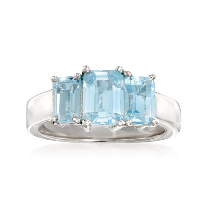 Sterling silver three-stone ring with sky blue topaz center and side stones