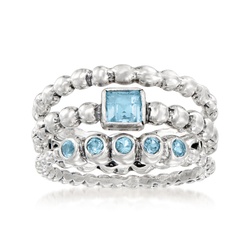 Sterling silver three-ring set with square blue topaz center and round blue stones