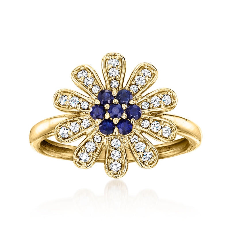 14kt yellow gold flower ring with blue sapphire center and white diamond petals