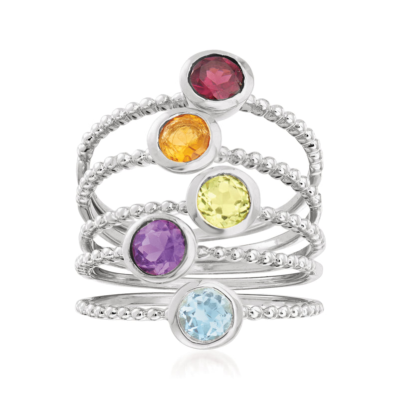 Sterling silver beaded ring set with five round faceted gemstones: red, orange, yellow, purple, blue.