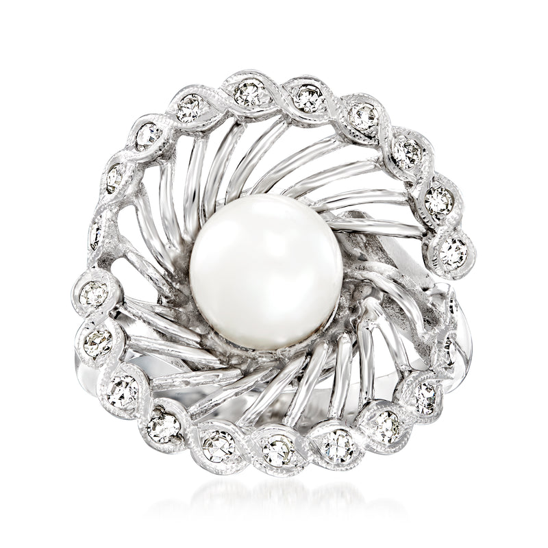 14kt white gold pinwheel ring with round cultured pearl and halo of small diamonds