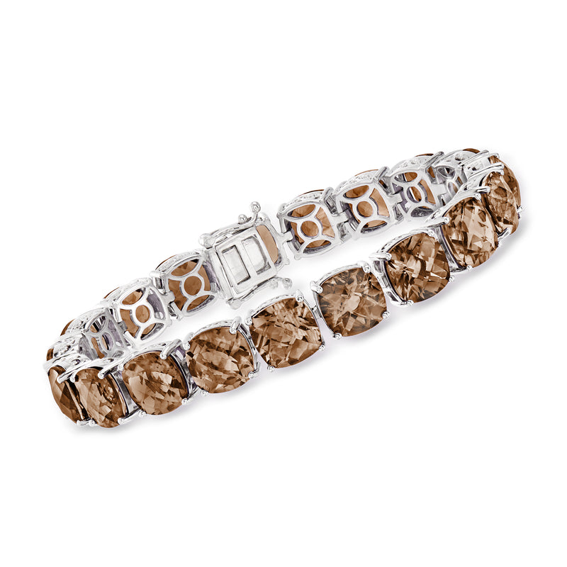 Sterling silver tennis bracelet with oval smoky topaz gemstones in prong settings