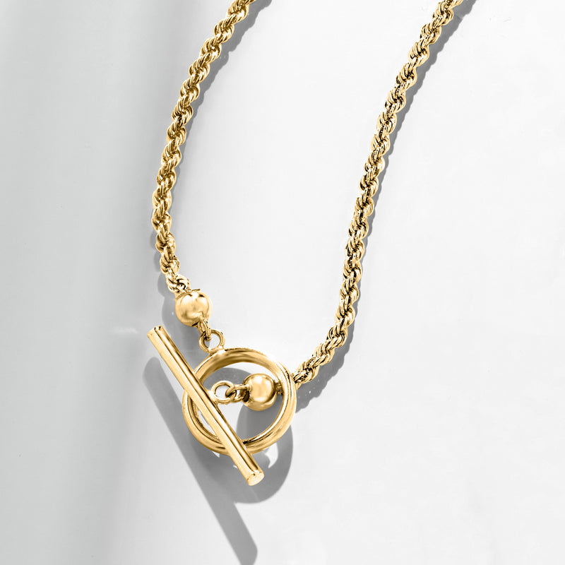 Yellow gold rope-chain toggle necklace with circular ring and bar clasp