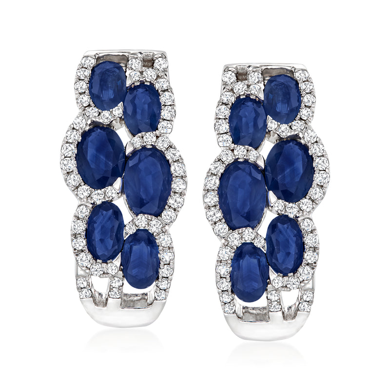 14kt white gold sapphire and diamond cluster hoop earrings with oval blue stones and clear halos
