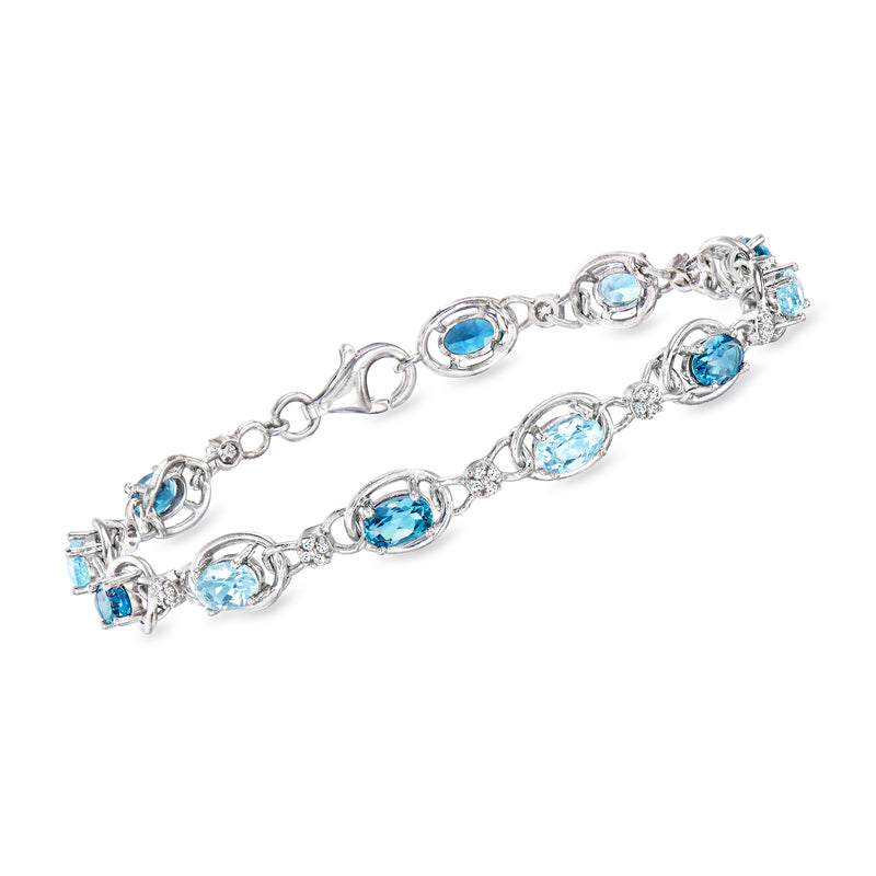Sterling silver bracelet with sky blue oval and round gemstones, link chain and clasp