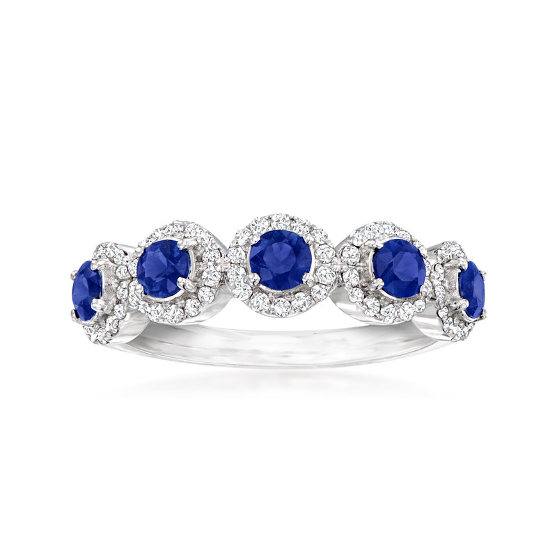 Three-stone sapphire and diamond ring in 14kt white gold, blue stones with diamond halos