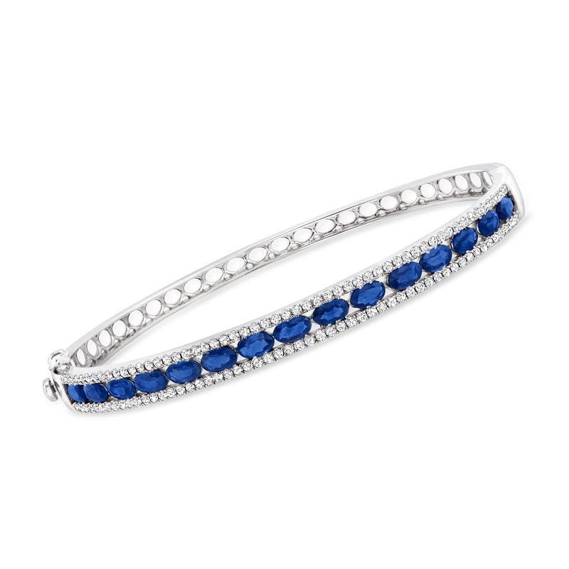 14kt white gold bangle bracelet with blue sapphire row and diamond accents