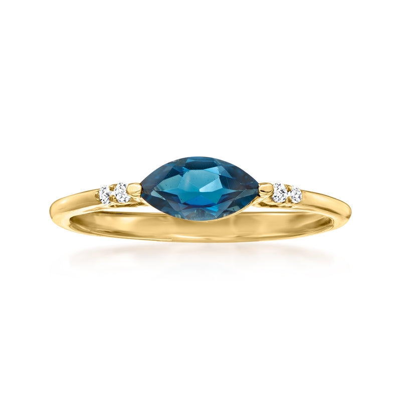 14kt yellow gold ring with oval blue topaz center and diamond accents on the band