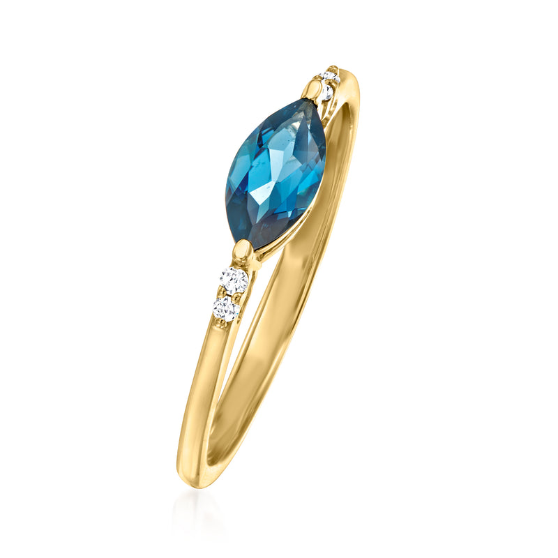Yellow gold topaz ring with oval London-blue stone and two diamond side accents