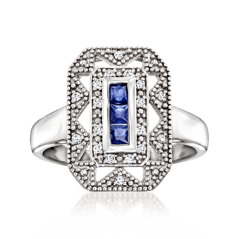 Sterling silver ring with rectangular blue sapphire center and diamond halo accents