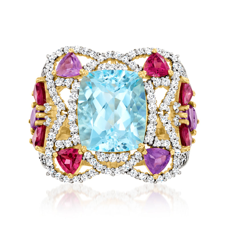 Sky blue topaz-style gemstone ring with purple accents and diamond-like halo, gold-tone