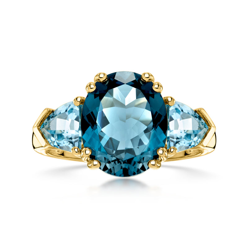 14kt yellow gold three-stone ring with large oval blue topaz center and side stones