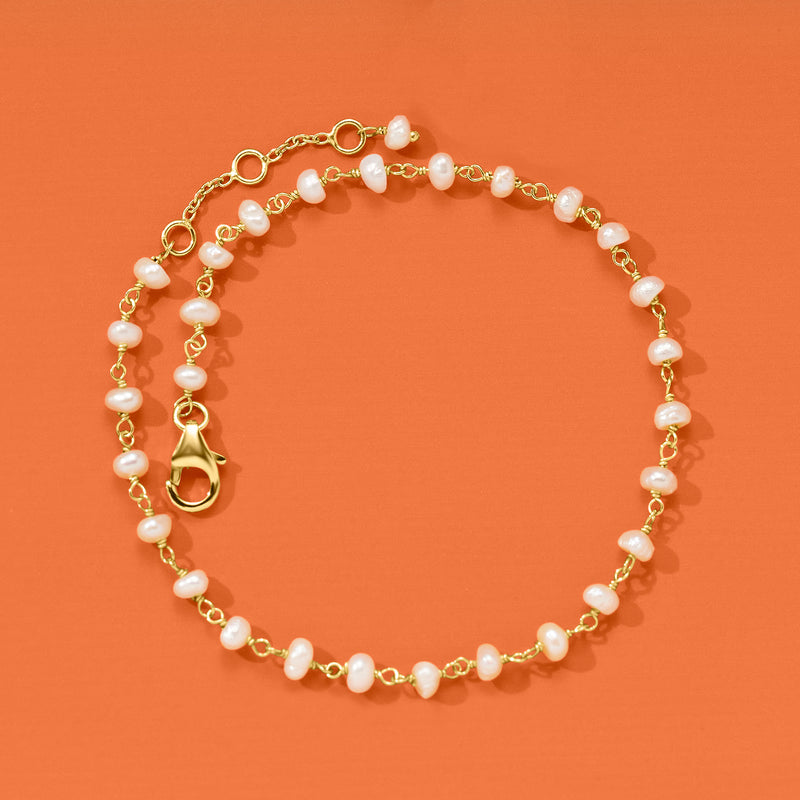 Gold-tone cultured pearl anklet with pink-peach pearls and heart toggle clasp