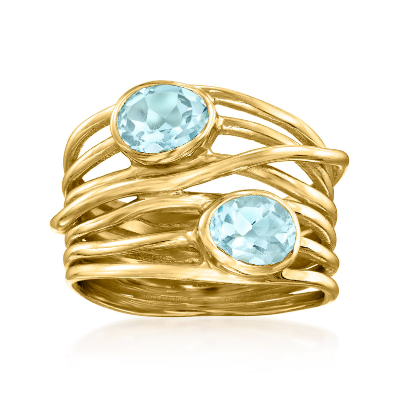 Gold over sterling ring with two oval sky-blue topaz accents in a crisscross design.