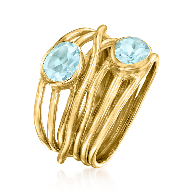 Gold over sterling topaz ring with two oval light-blue stones and layered ribbon bands.