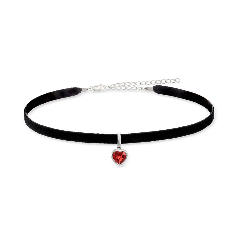 Black velvet choker necklace with red heart gemstone pendant on a silver setting