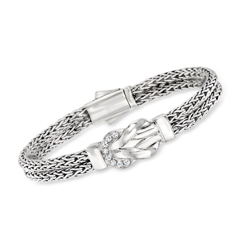 Sterling silver woven chain bracelet with clasp and knot centerpiece set with clear stones