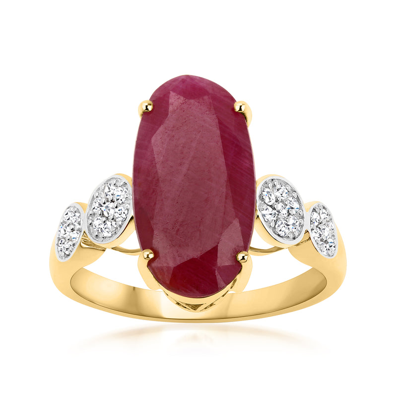 Oval ruby and diamond ring in 14kt yellow gold with four round diamond accents