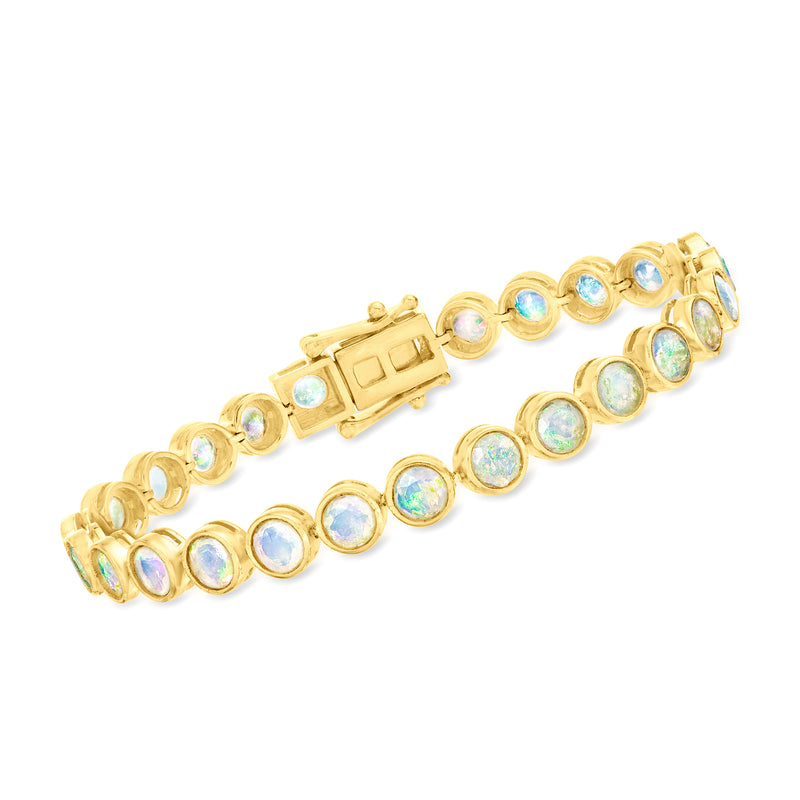 Gold tennis bracelet with round opal-like stones and hinged clasp