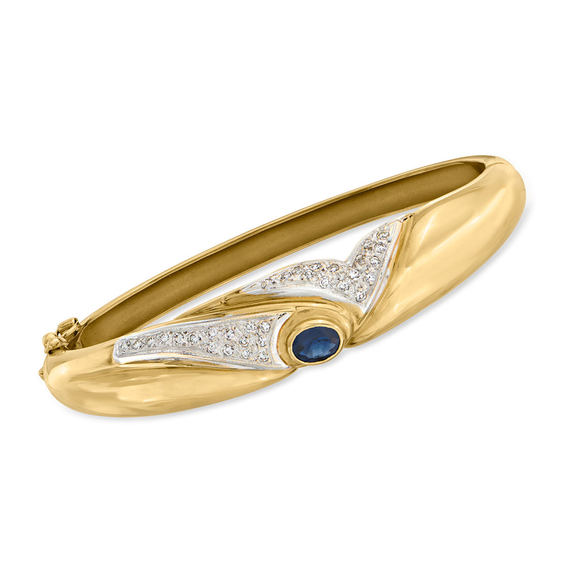 Two-tone gold bangle bracelet with blue sapphire and diamond-set arcs