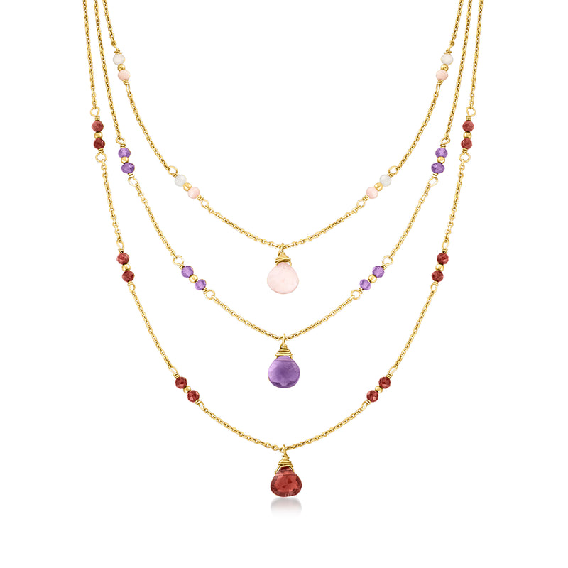 Gold layered necklace with pink opal, purple and red gemstone drops on three chains