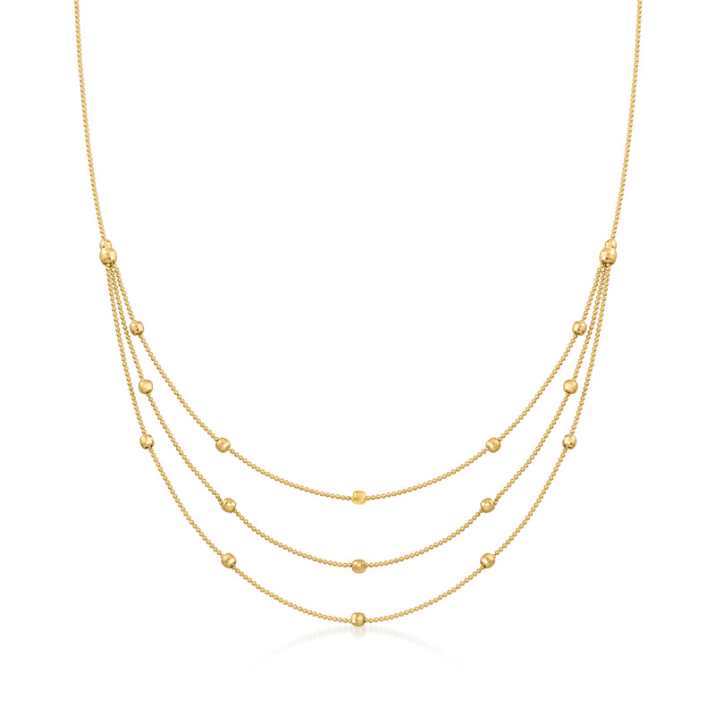 Yellow gold three-strand bead station necklace with layered bead stations