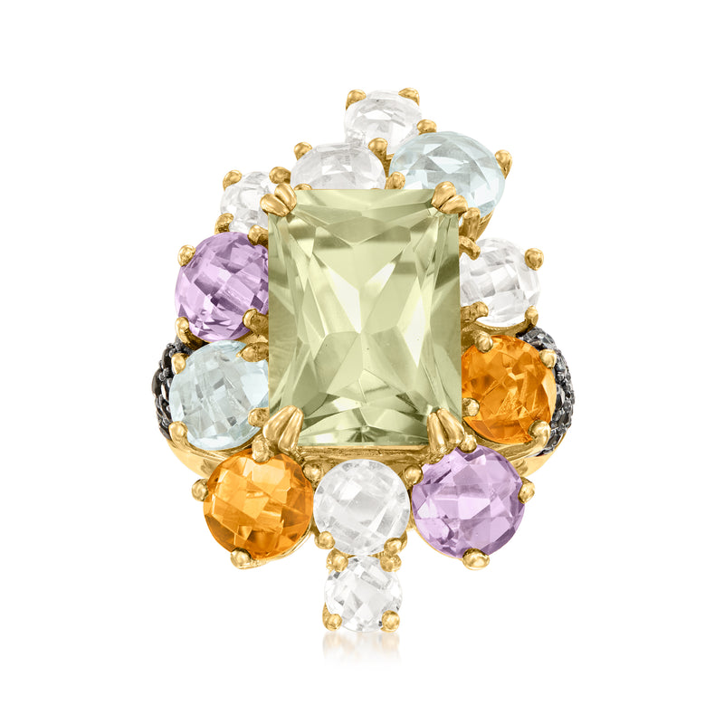 Gold-tone multi-gemstone ring with large light green center stone and purple/white accents