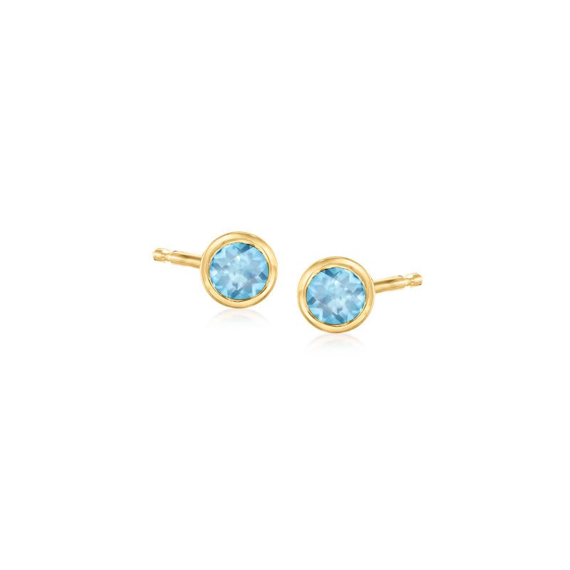 Round blue topaz stud earrings in 14kt yellow gold