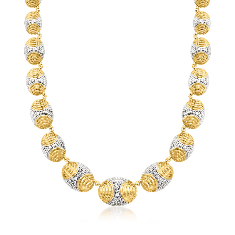 Graduated oval-link necklace with gold and silver-toned oval stations