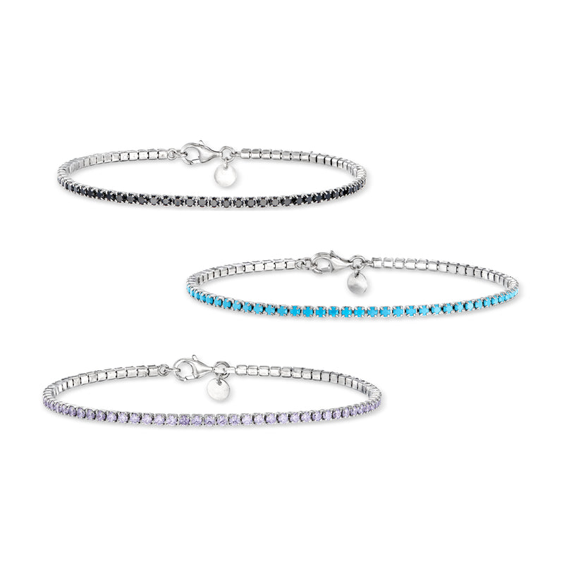 Three sterling silver tennis bracelets with dark, turquoise, and purple gemstone rows