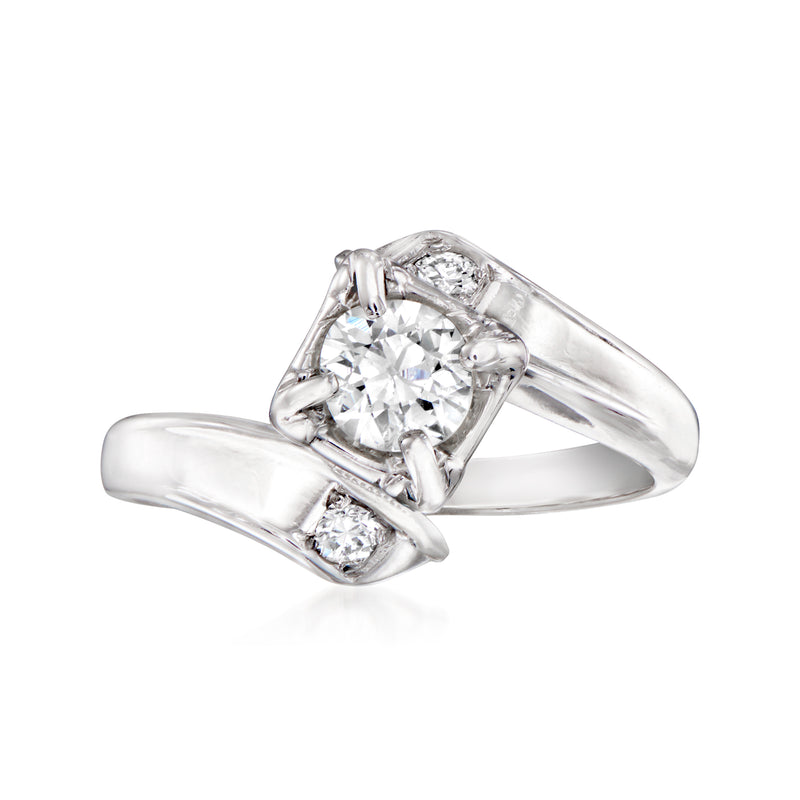 Vintage 14kt white gold diamond bypass ring with three round stones