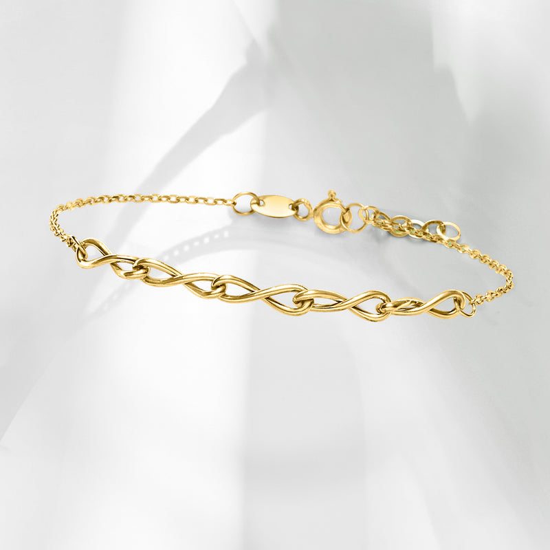 10kt yellow gold twisted infinity-link bracelet, angled view of chain links and clasp
