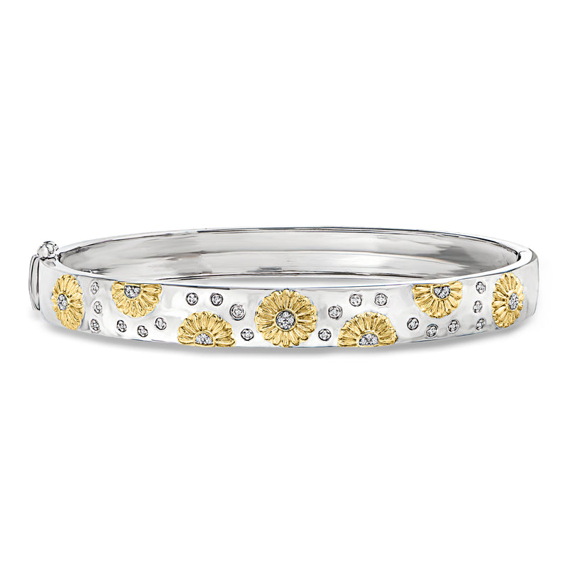 Two-tone sterling silver bangle with gold sunflower motifs and clear stone accents