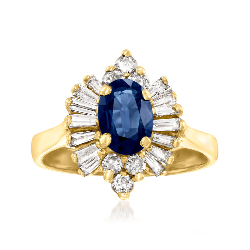 Vintage 14k yellow gold ring with oval dark-blue sapphire center and diamond side stones