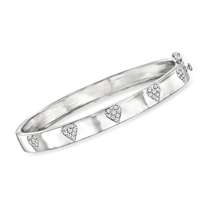 Sterling silver bangle bracelet with three diamond heart details, hinged clasp