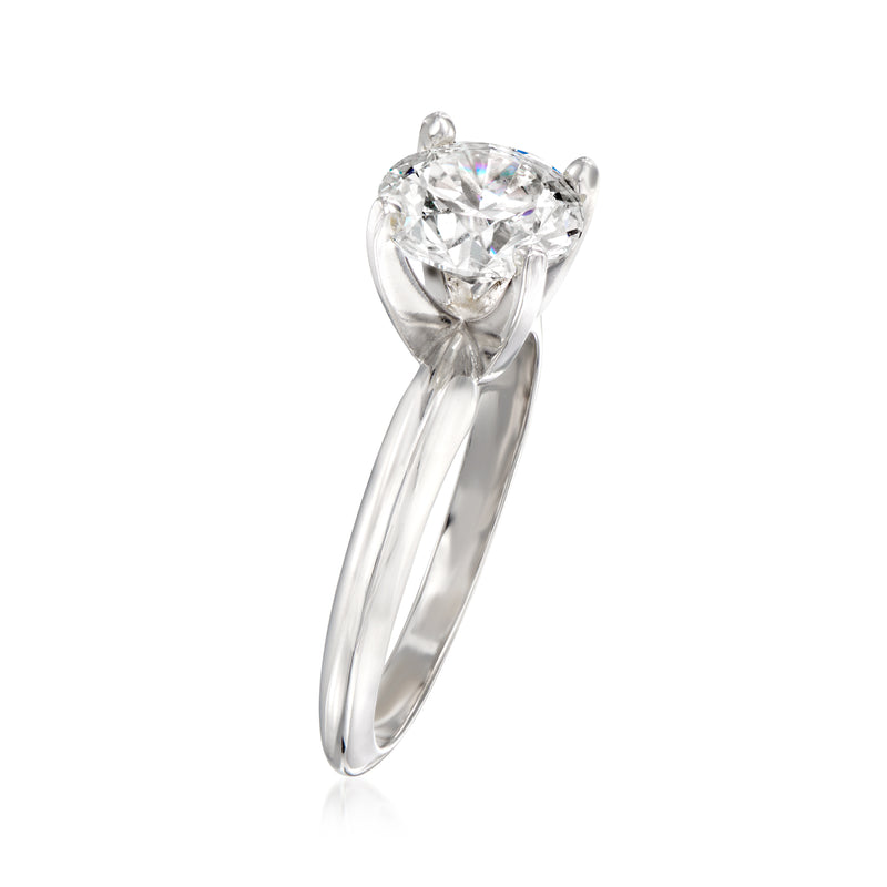 Prong-set round diamond solitaire ring with sculpted white gold band, side view